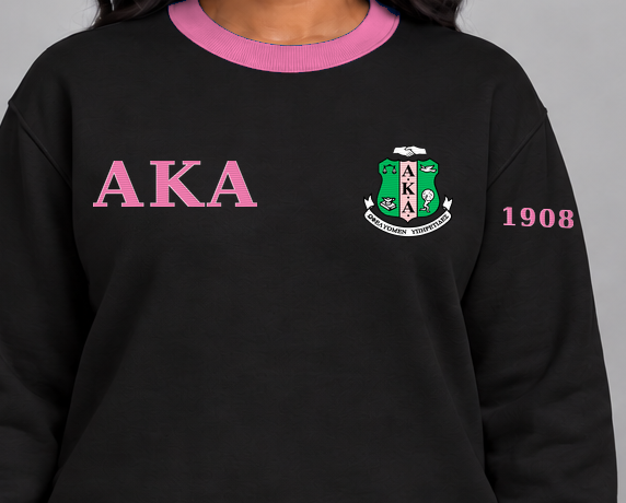 Alpha Kappa Alpha premium embroidered black solid contrast trim crewneck sweatshirt on model - chest embroidery close-up