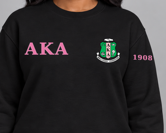 Alpha Kappa Alpha premium embroidered black solid crewneck sweatshirt on model - chest embroidery close-up