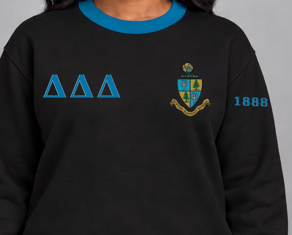 Delta Delta Delta premium embroidered black solid contrast trim crewneck sweatshirt on model - chest embroidery close-up