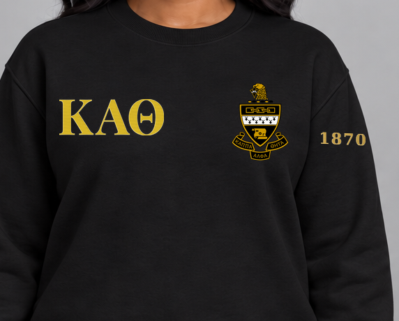 Kappa Alpha Theta premium embroidered black solid crewneck sweatshirt on model - chest embroidery close-up