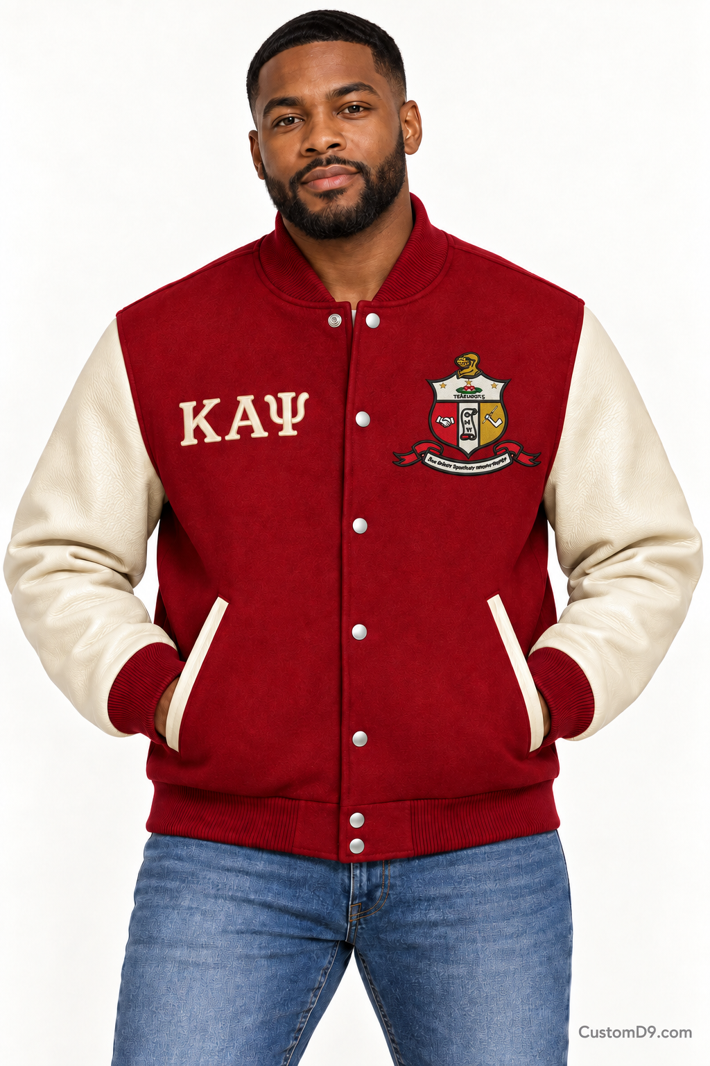 Black man modeling Kappa Alpha Psi premium contrast varsity jacket with crimson body and cream sleeves, front view.