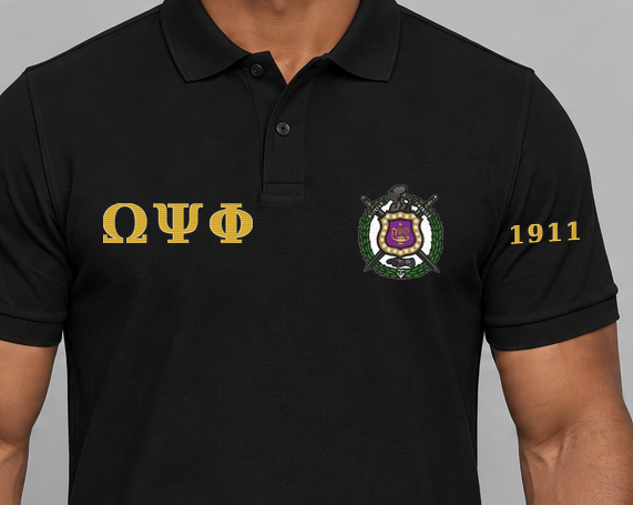 Omega Psi Phi premium embroidered black solid polo on model - chest embroidery close-up