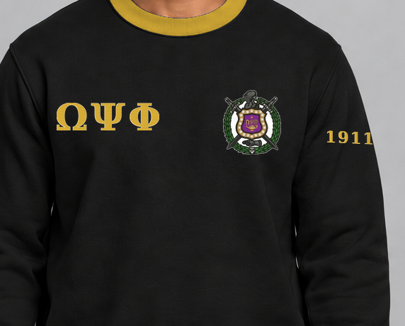 Omega Psi Phi premium embroidered black solid contrast trim crewneck sweatshirt on model - chest embroidery close-up