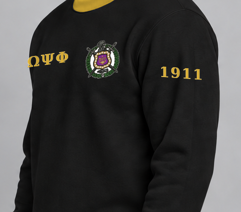 Omega Psi Phi premium embroidered black solid contrast trim crewneck sweatshirt on model - founding year sleeve detail