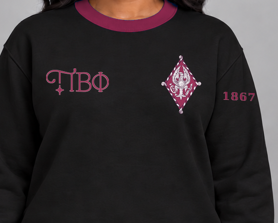 Pi Beta Phi premium embroidered black solid contrast trim crewneck sweatshirt on model - chest embroidery close-up