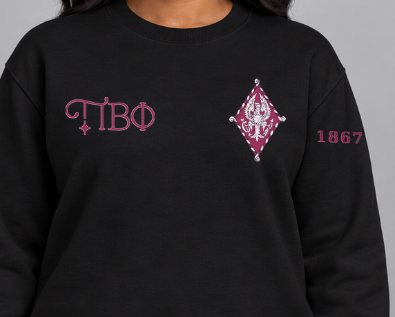 Pi Beta Phi premium embroidered black solid crewneck sweatshirt on model - chest embroidery close-up