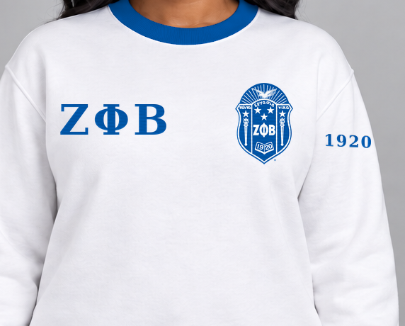 Zeta Phi Beta premium embroidered white solid contrast trim crewneck sweatshirt on model - chest embroidery close-up