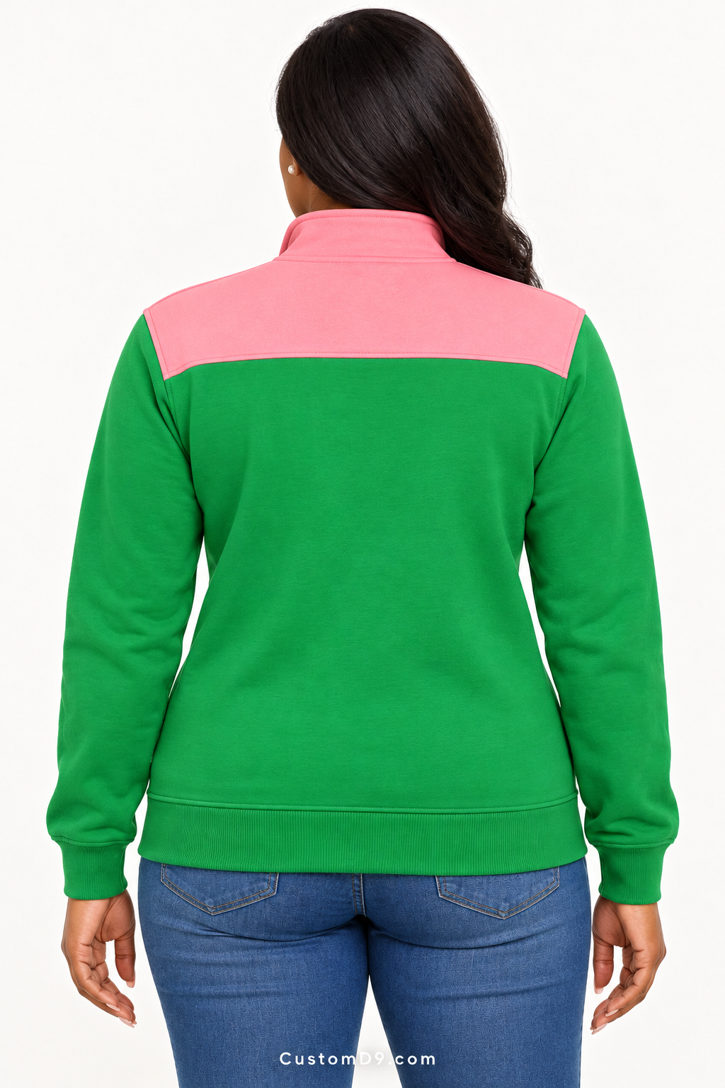 Black female model showing back of Alpha Kappa Alpha apple green quarter-zip with salmon pink shoulder panel