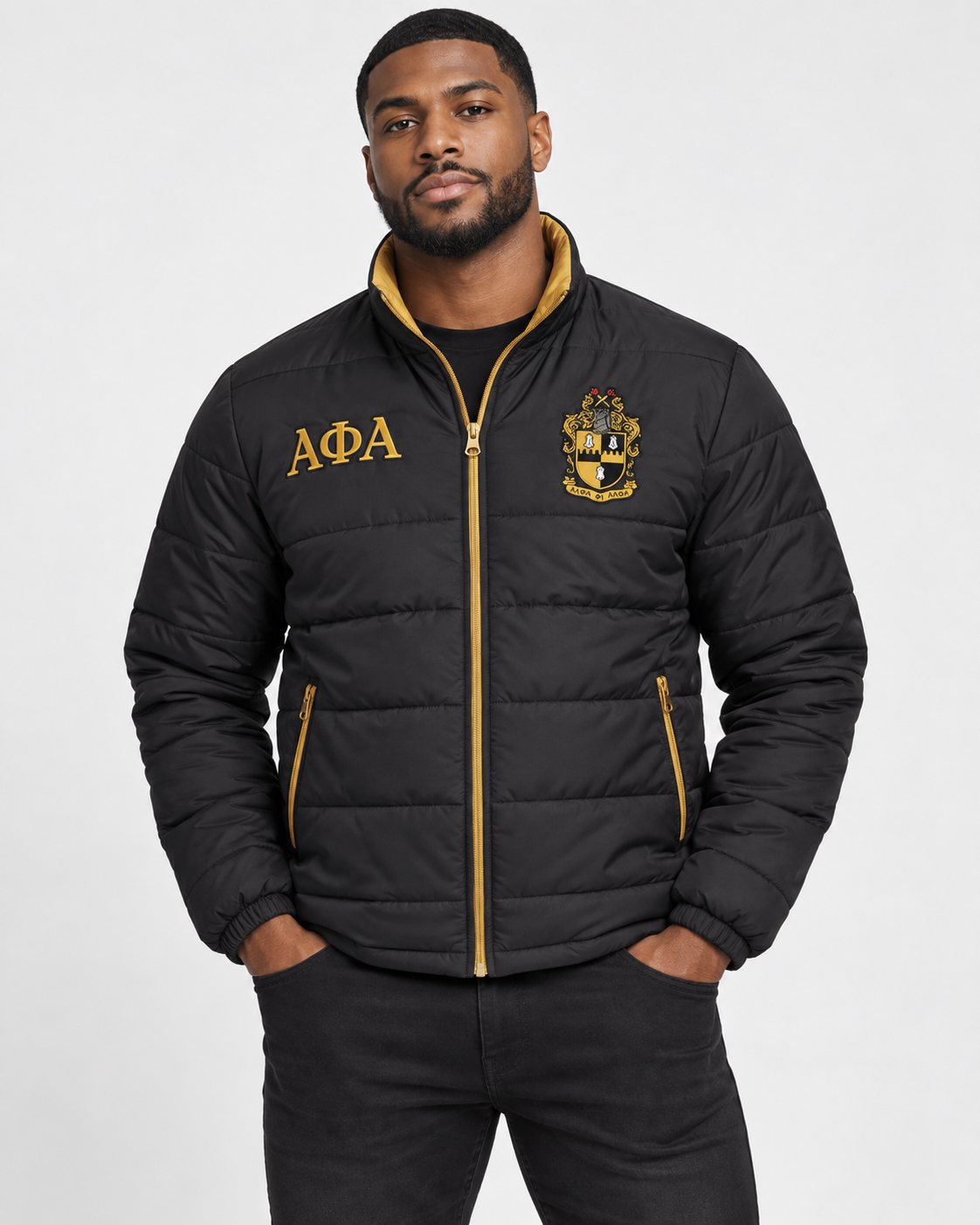 Alpha Phi Alpha black puffer jacket with old gold contrast and embroidery on male model