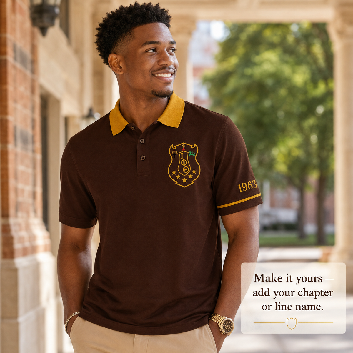 Iota Phi Theta brown polo with gold collar and sleeve trim, crest on left chest and 1963 on left sleeve
