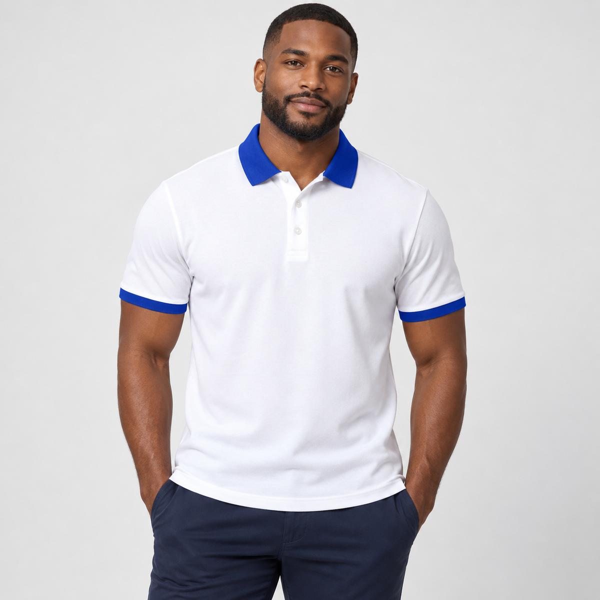 Blank white men's polo with royal blue collar and sleeve trim on a model