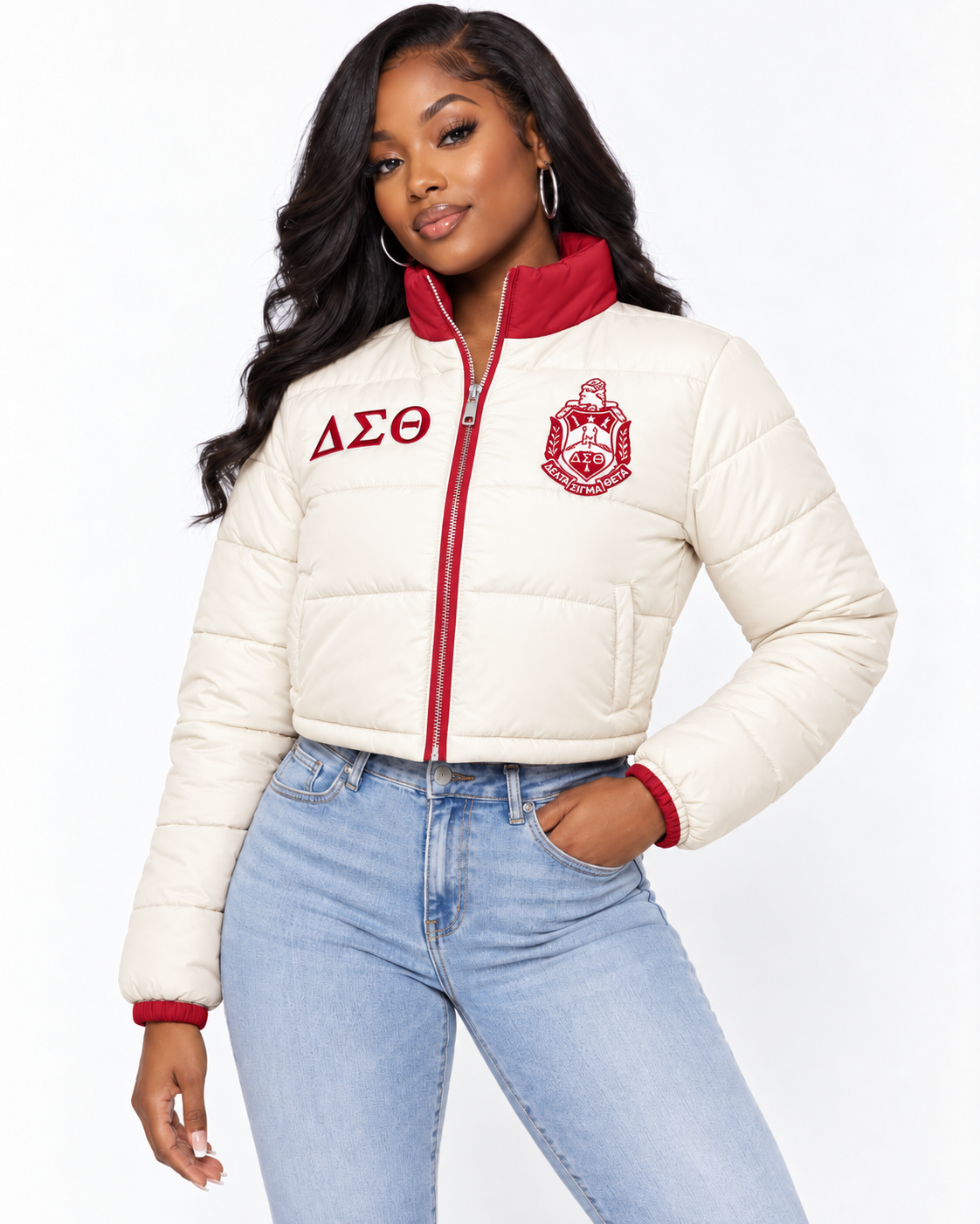 Delta Sigma Theta cream cropped puffer jacket with crimson contrast and embroidery on female model