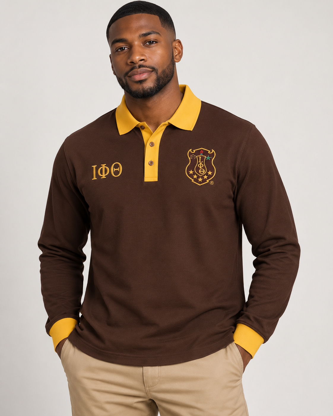 Iota Phi Theta brown body gold collar placket and cuffs long sleeve contrast polo on male model