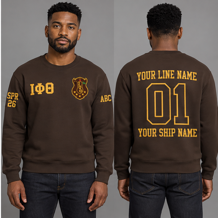 Iota Phi Theta Charcoal Brown crewneck sweatshirt on an adult model, Gilded Gold Greek letters ΙΦΘ, original supplied crest, sample line name, line number 01 and ship name, right sleeve SPR 26 and left sleeve ABC.