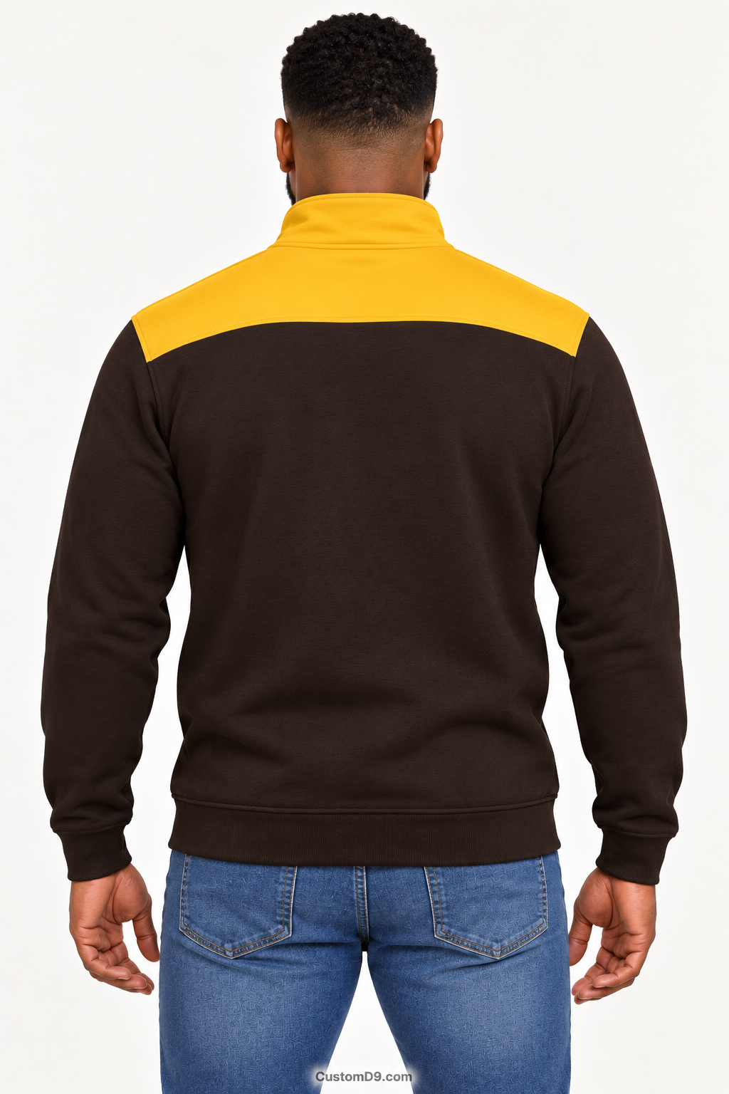 Black male model showing back of Iota Phi Theta charcoal brown quarter-zip with gilded gold shoulder panel