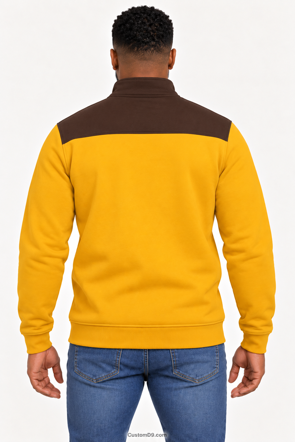 Black male model showing back of Iota Phi Theta gilded gold quarter-zip with charcoal brown shoulder panel