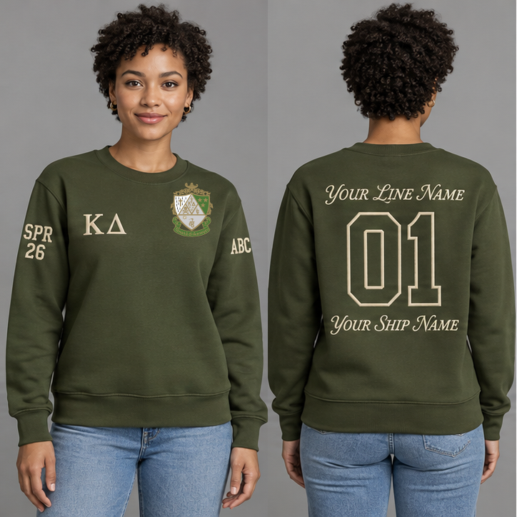 Kappa Delta Olive Green crewneck sweatshirt on an adult model, Pearl White Greek letters ΚΔ, original supplied crest, sample line name, line number 01 and ship name, right sleeve SPR 26 and left sleeve ABC.