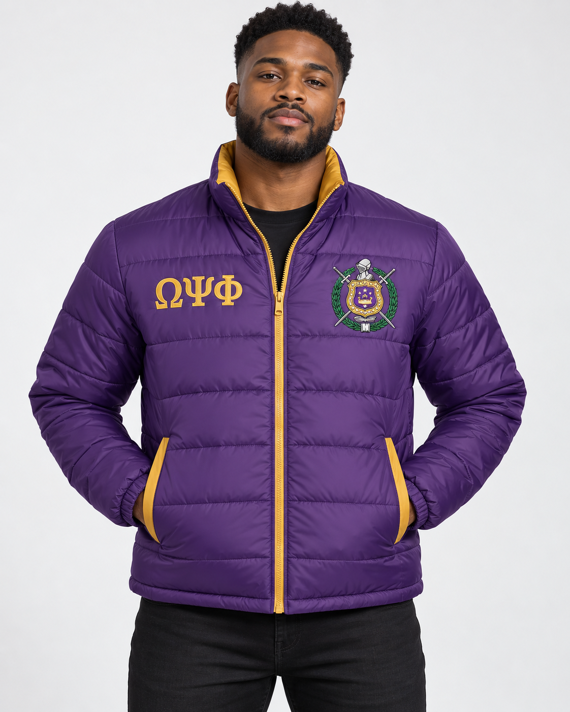 Omega Psi Phi purple puffer jacket with old gold contrast and embroidery on male model