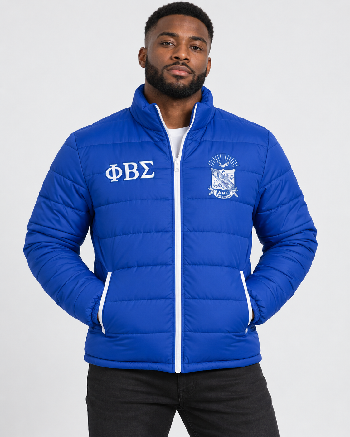 Phi Beta Sigma royal blue puffer jacket with white contrast and embroidery on male model