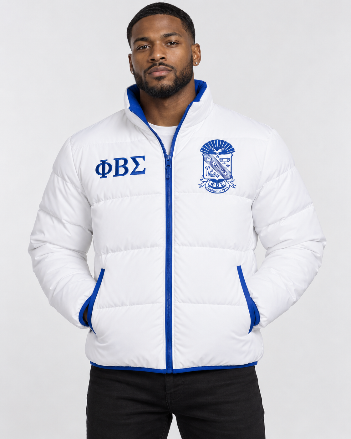 Phi Beta Sigma white puffer jacket with royal blue contrast and embroidery on male model