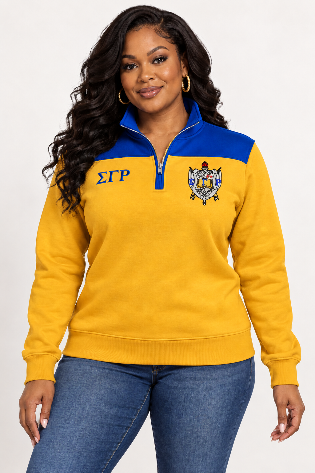Black female model showing front of Sigma Gamma Rho gold quarter-zip with royal blue shoulder panel