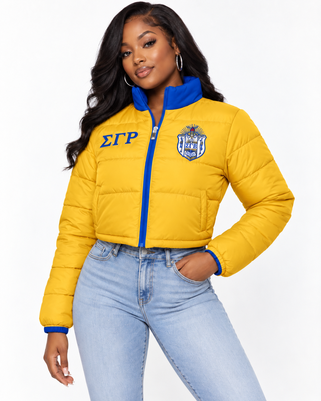 Sigma Gamma Rho gold cropped puffer jacket with royal blue contrast and embroidery on female model