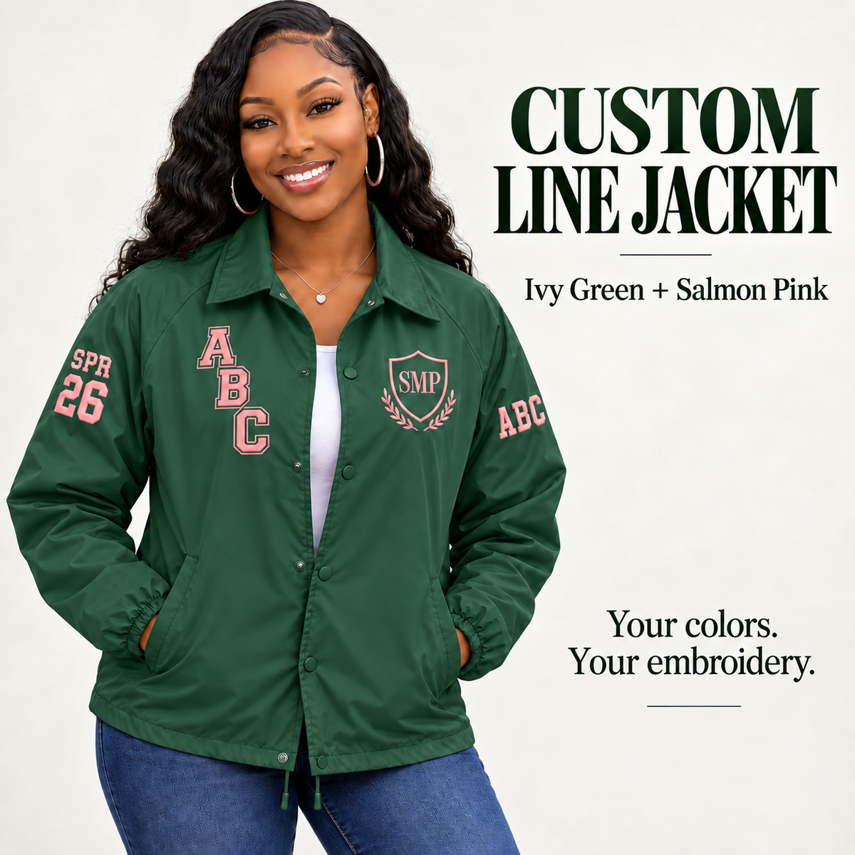 Ivy Green nylon snap-front line jacket with salmon pink sample embroidery on a female model
