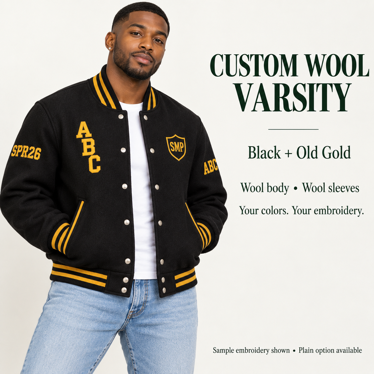 Man wearing Black wool body and wool sleeve varsity jacket with Old Gold sample embroidery