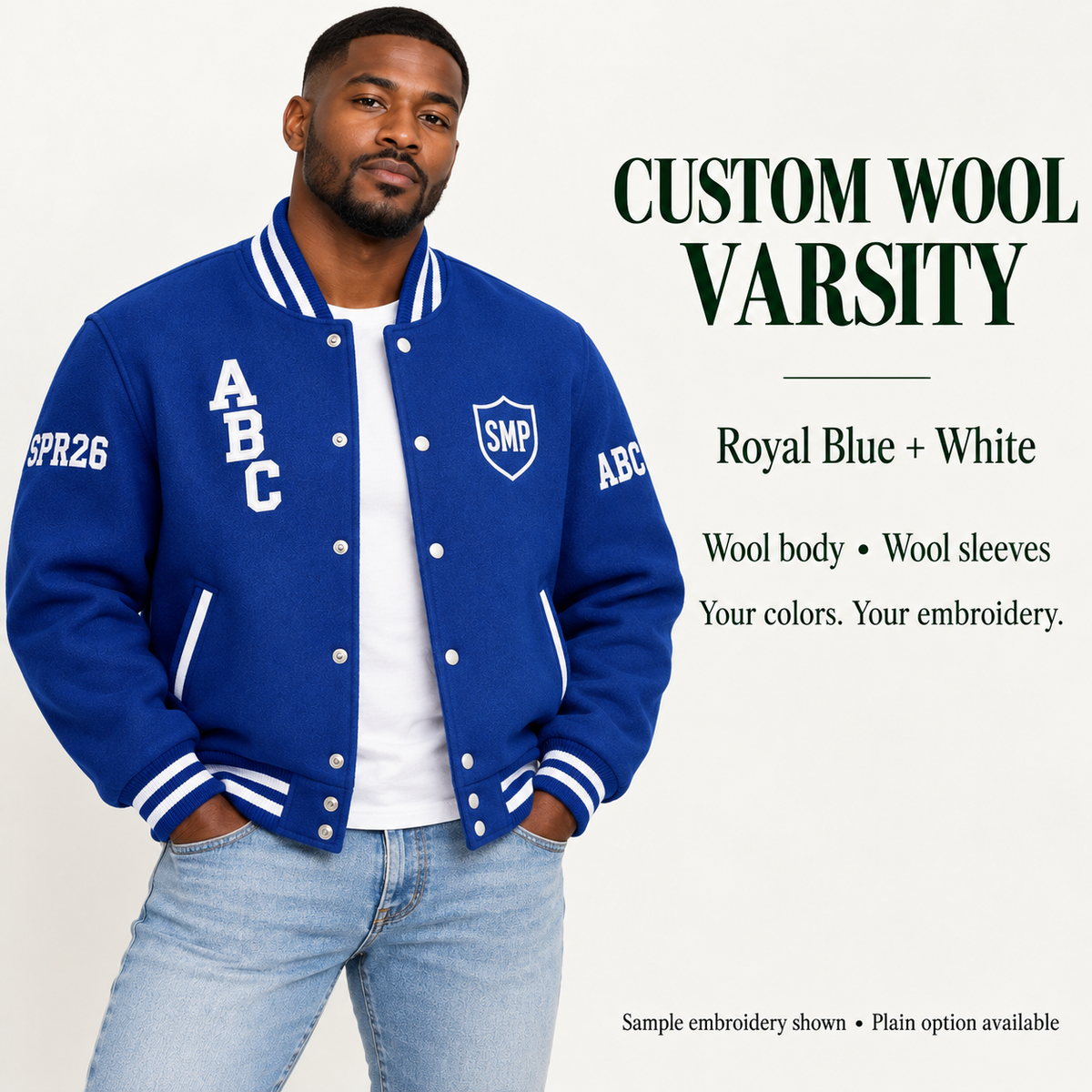 Man wearing Royal Blue wool body and wool sleeve varsity jacket with White sample embroidery