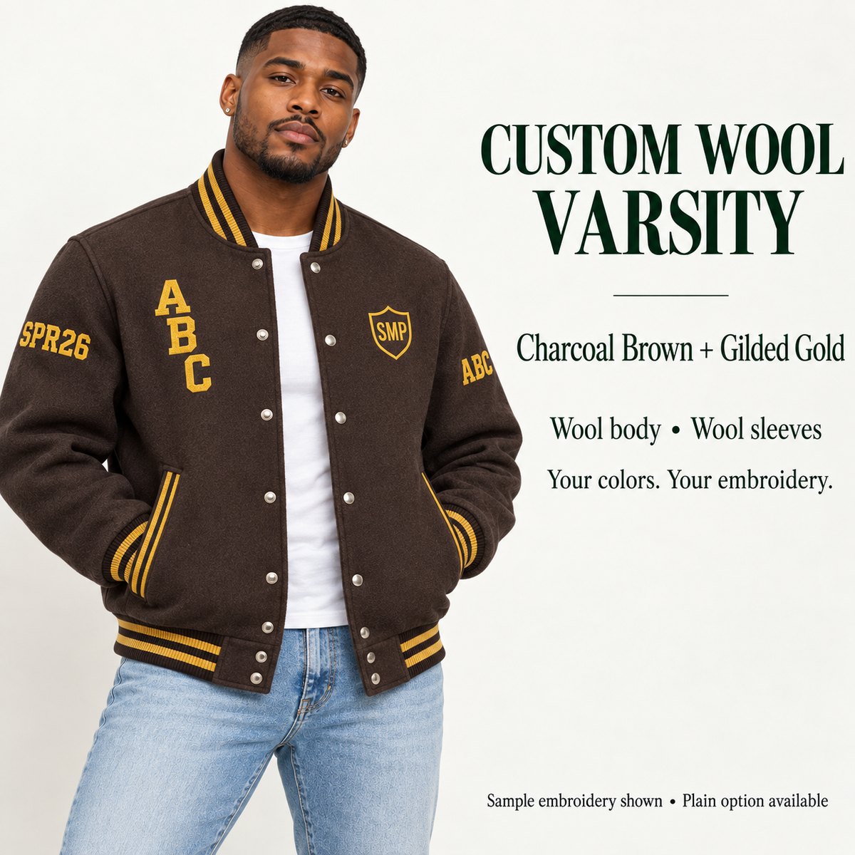 Man wearing Charcoal Brown wool body and wool sleeve varsity jacket with Gilded Gold sample embroidery