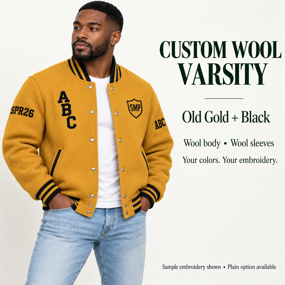 Man wearing Old Gold wool body and wool sleeve varsity jacket with Black sample embroidery