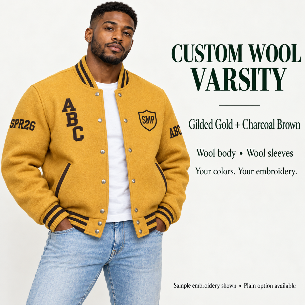 Man wearing Gilded Gold wool body and wool sleeve varsity jacket with Charcoal Brown sample embroidery