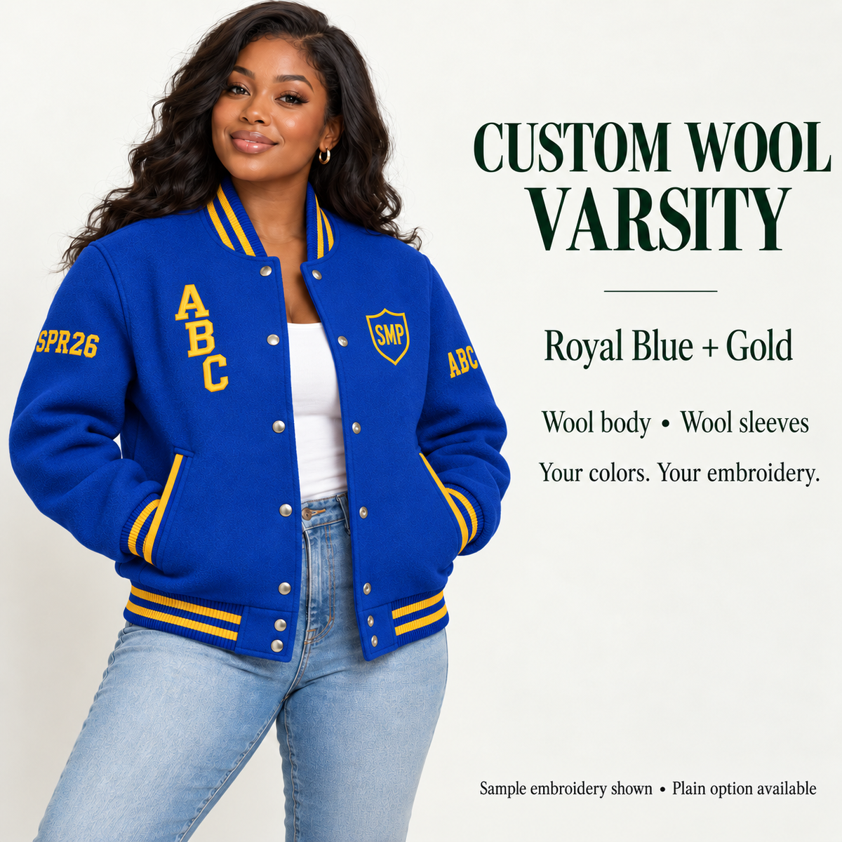 Woman wearing Royal Blue wool body and wool sleeve varsity jacket with Gold sample embroidery