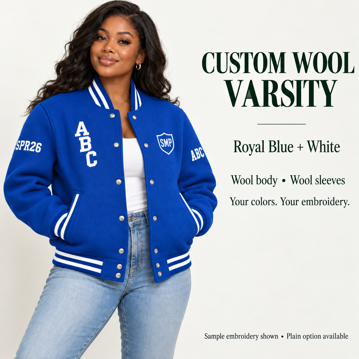 Woman wearing Royal Blue wool body and wool sleeve varsity jacket with White sample embroidery