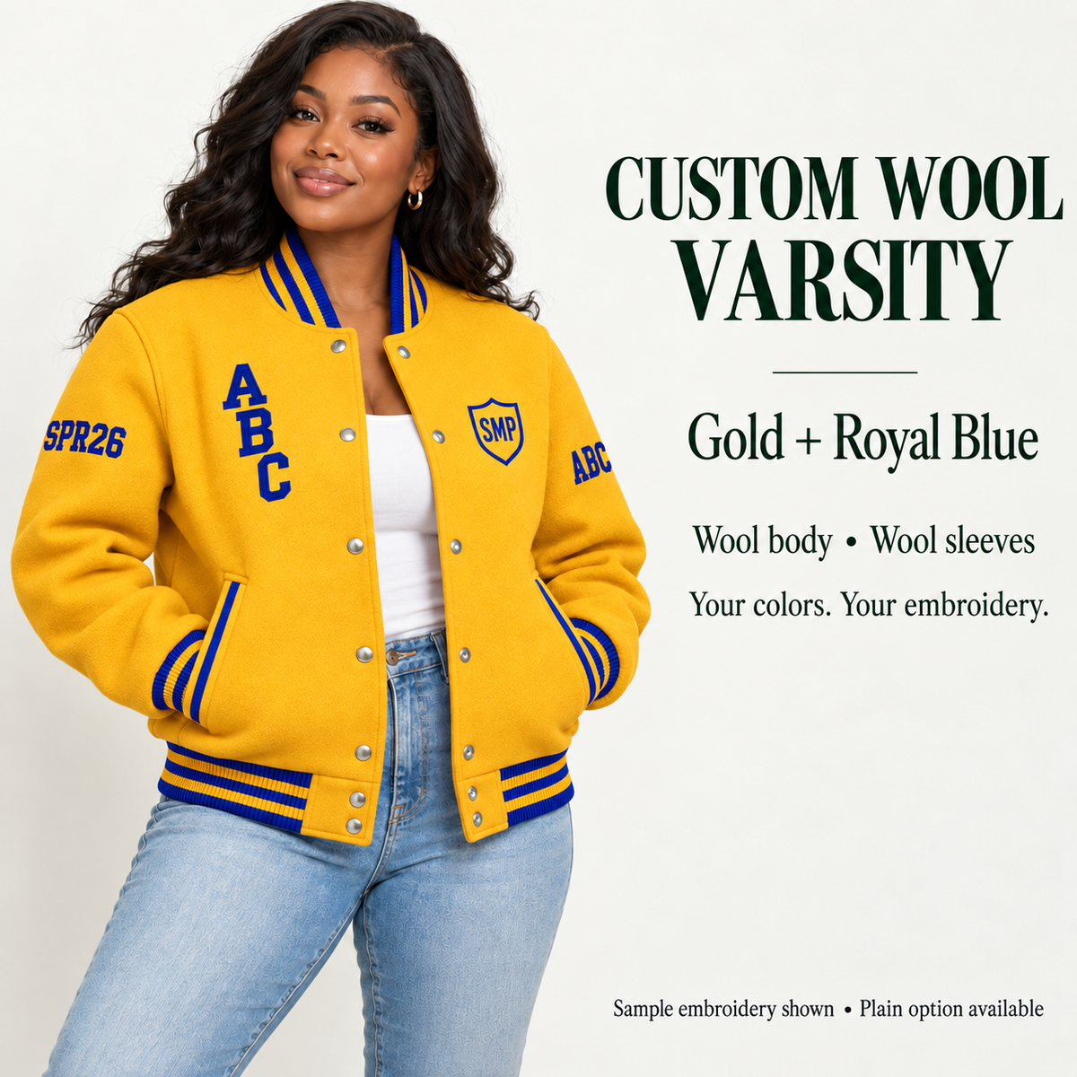 Woman wearing Gold wool body and wool sleeve varsity jacket with Royal Blue sample embroidery