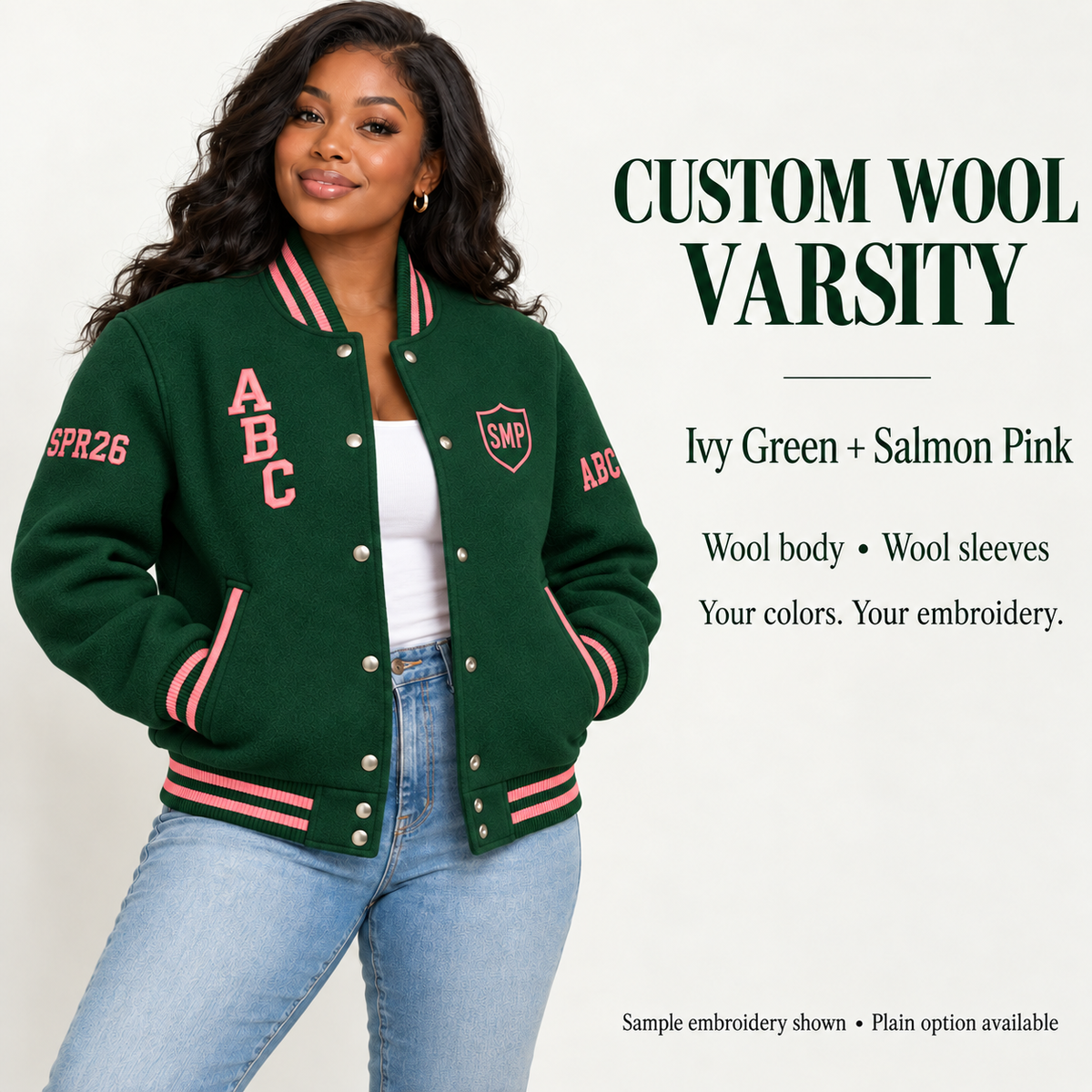 Woman wearing Ivy Green wool body and wool sleeve varsity jacket with Salmon Pink sample embroidery