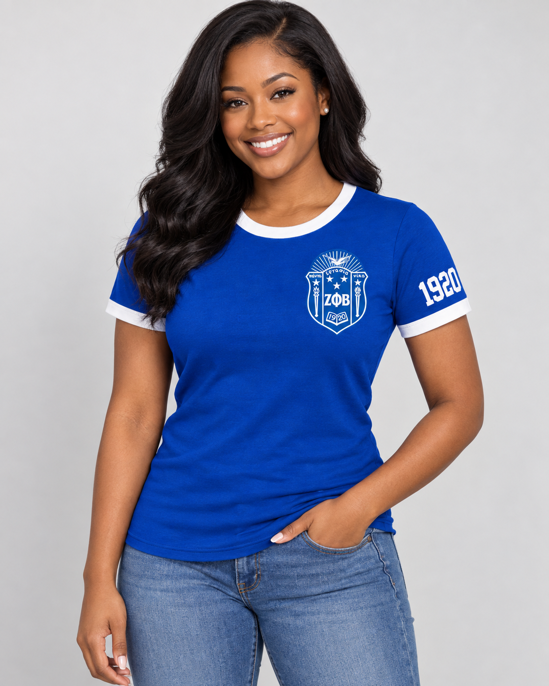 Black woman modeling royal blue Zeta Phi Beta ringer T-shirt with white trim, left chest crest and 1920 on the same-side sleeve