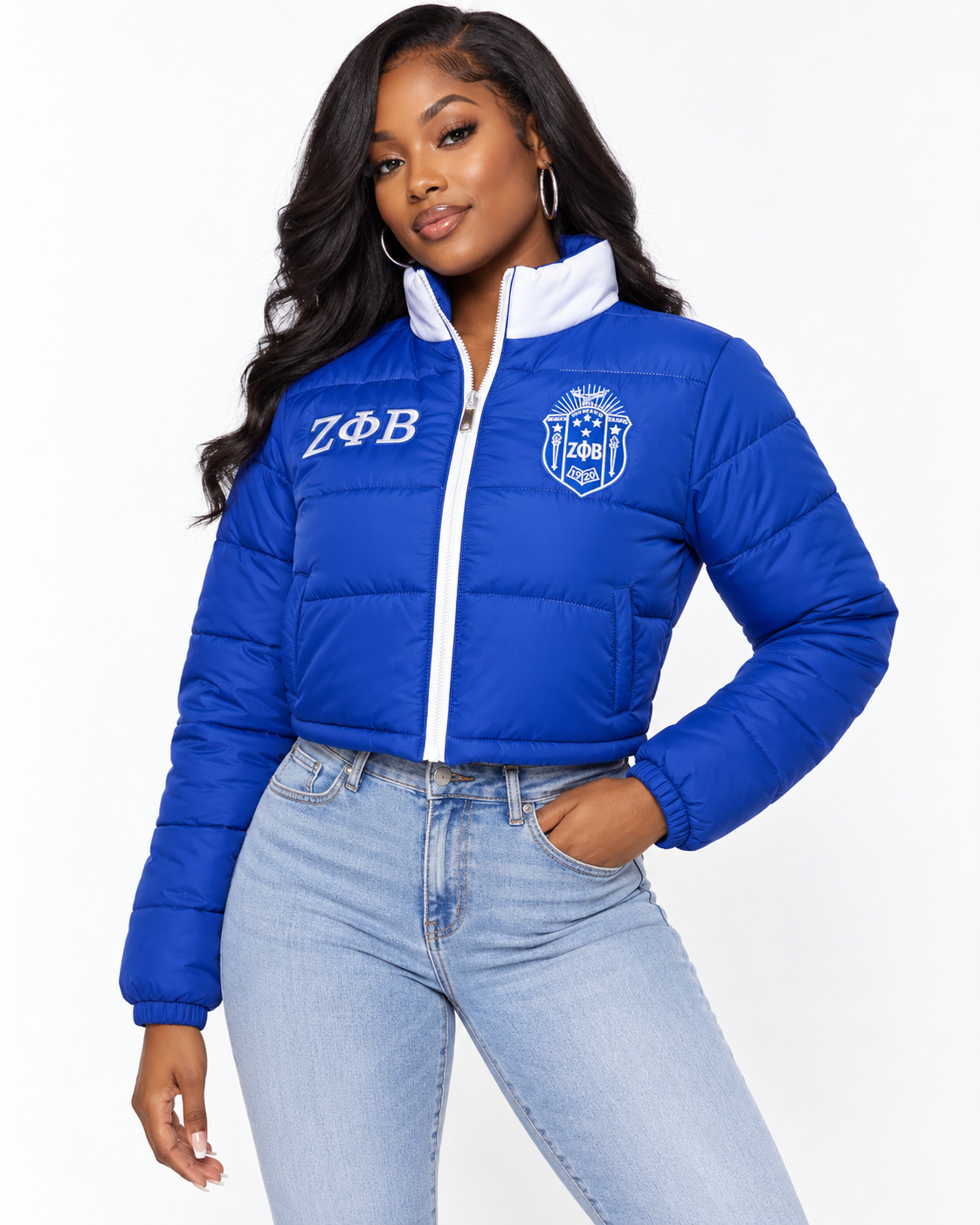Zeta Phi Beta royal blue cropped puffer jacket with white contrast and embroidery on female model