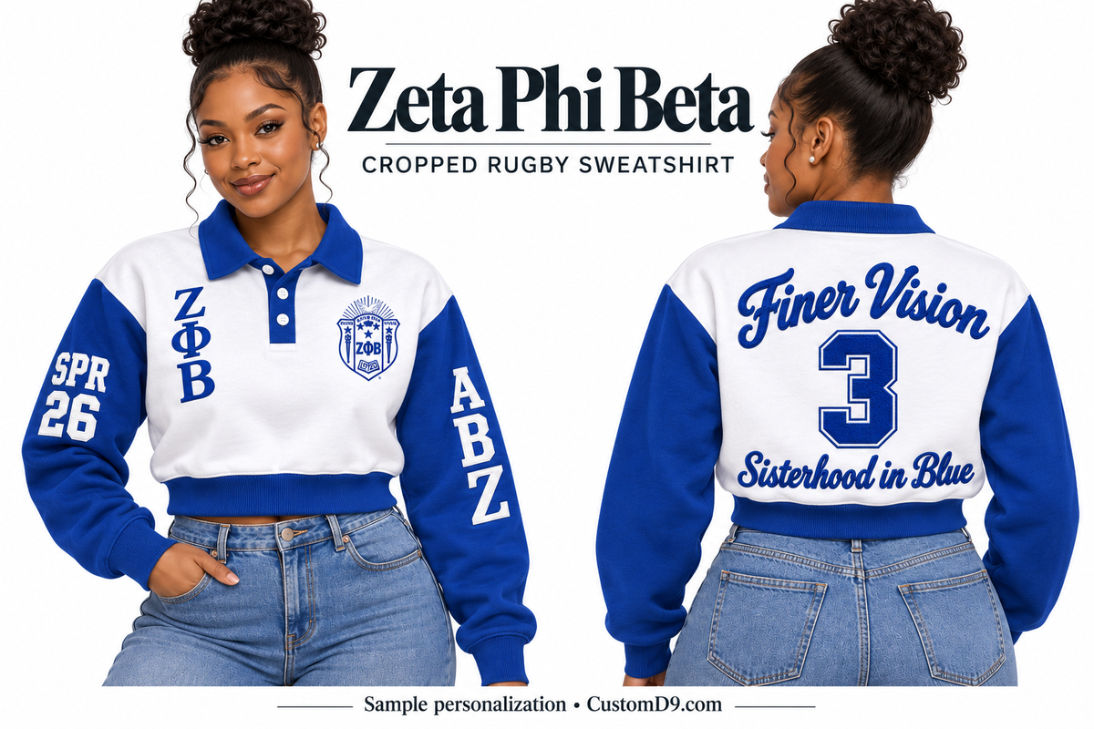 Zeta Phi Beta White & Royal Blue Cropped Rugby Sweatshirt, front and back model views with optional crest, Greek letters and sample sleeve and back personalization